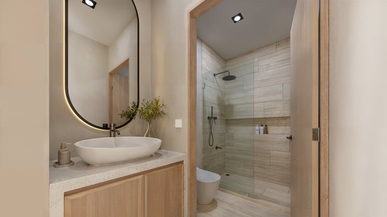 Modern bathroom with round vessel sink, wood vanity, oval mirror, and walk-in shower with white subway tile and glass enclosure