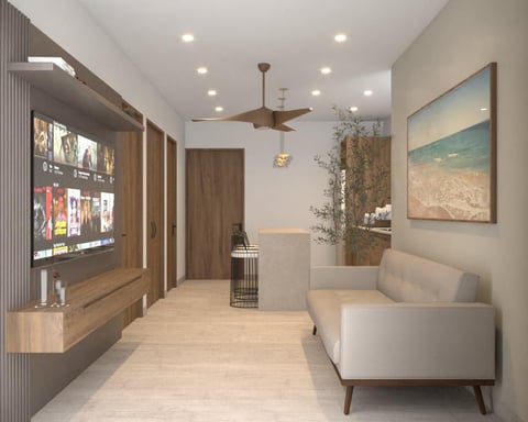 Modern living room interior with beige sofa, wooden TV unit, ceiling fan, and artwork on walls