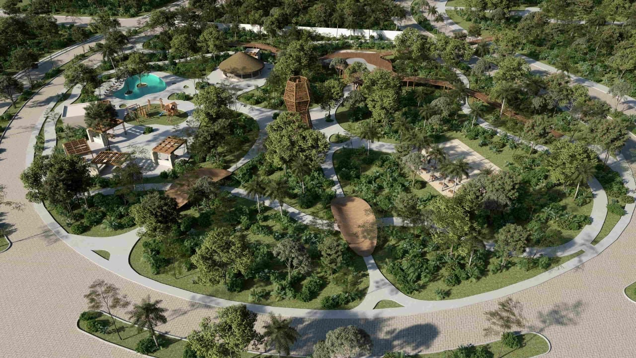 Aerial view of a luxury residential community with winding roads, lush green trees, and a swimming pool nestled among landscaped grounds